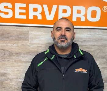 Man in front of SERVPRO sign