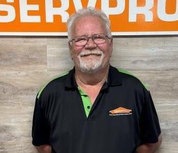 Man in front of SERVPRO sign