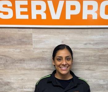 Woman in front of SERVPRO sign