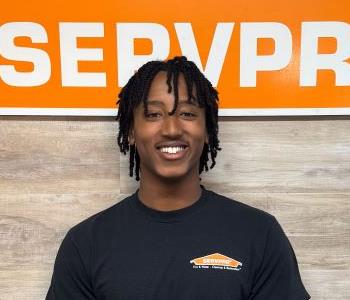 Man in front of SERVPRO sign