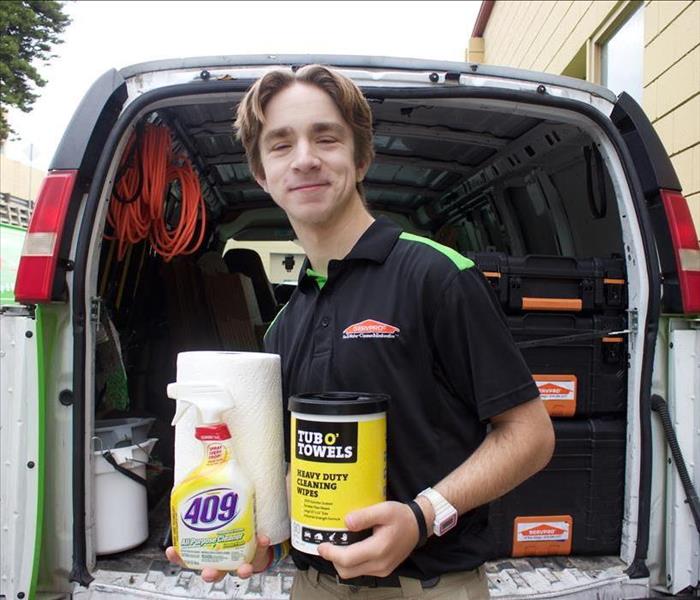 SERVPRO of San Diego East technician posing with cleaning supplies