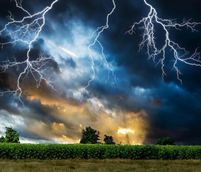 dramatic lightning storm above farmlands