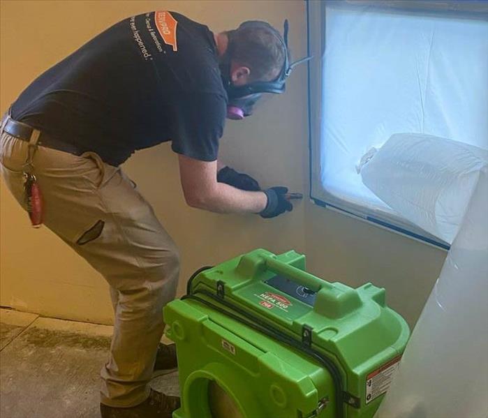 SERVPRO employee working in a home.